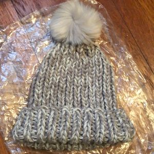 Never worn grey pom pom hat